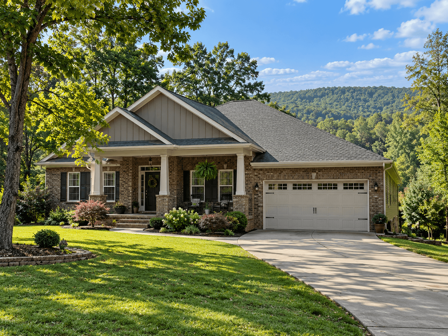 Brick home in Cookeville, Tennessee, surrounded by mature trees and rolling wooded hills in the Upper Cumberland region.